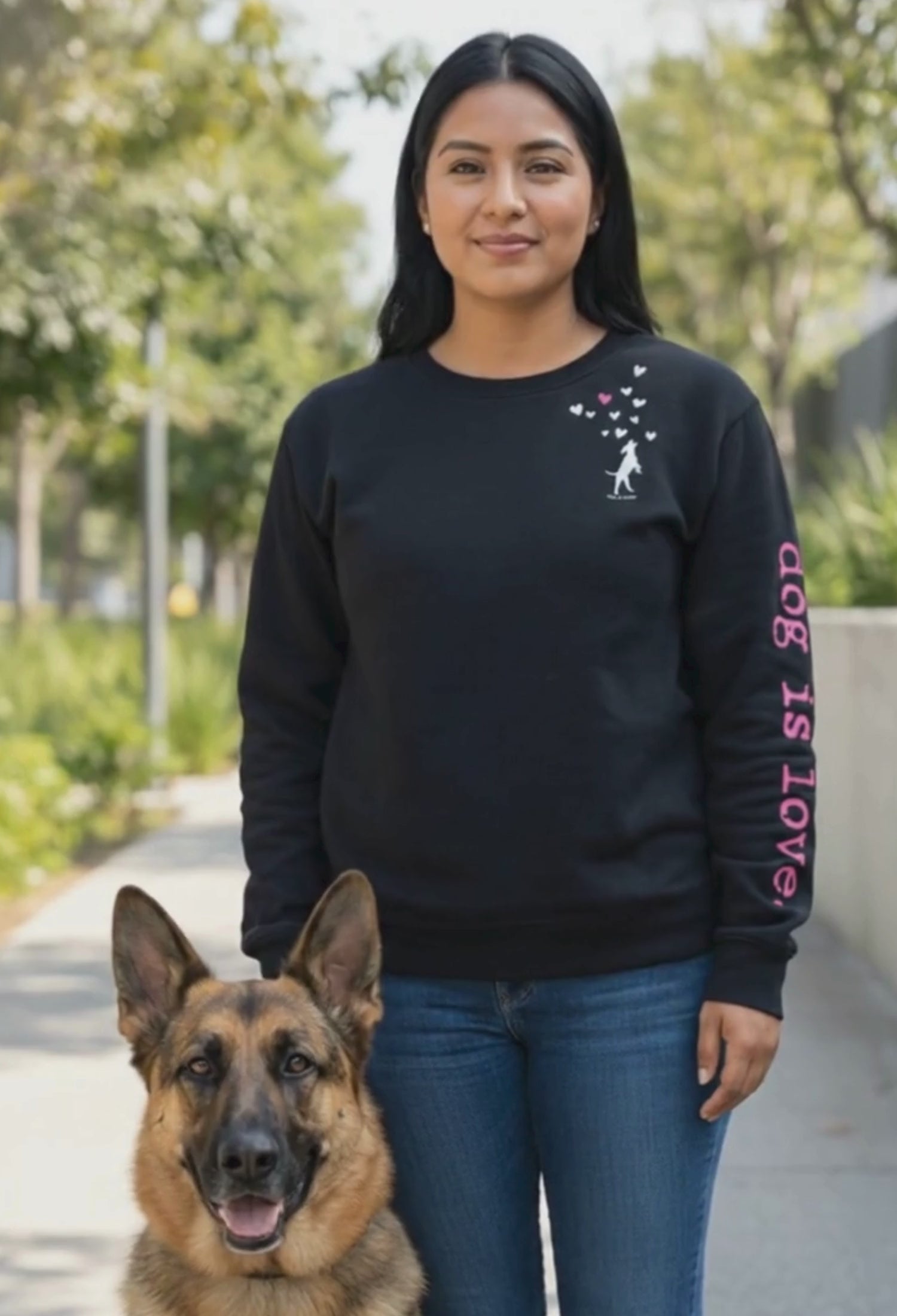 woman wearing black crewneck fleece standing next to dog